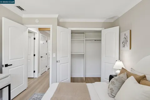 a bedroom with a bed and a closet