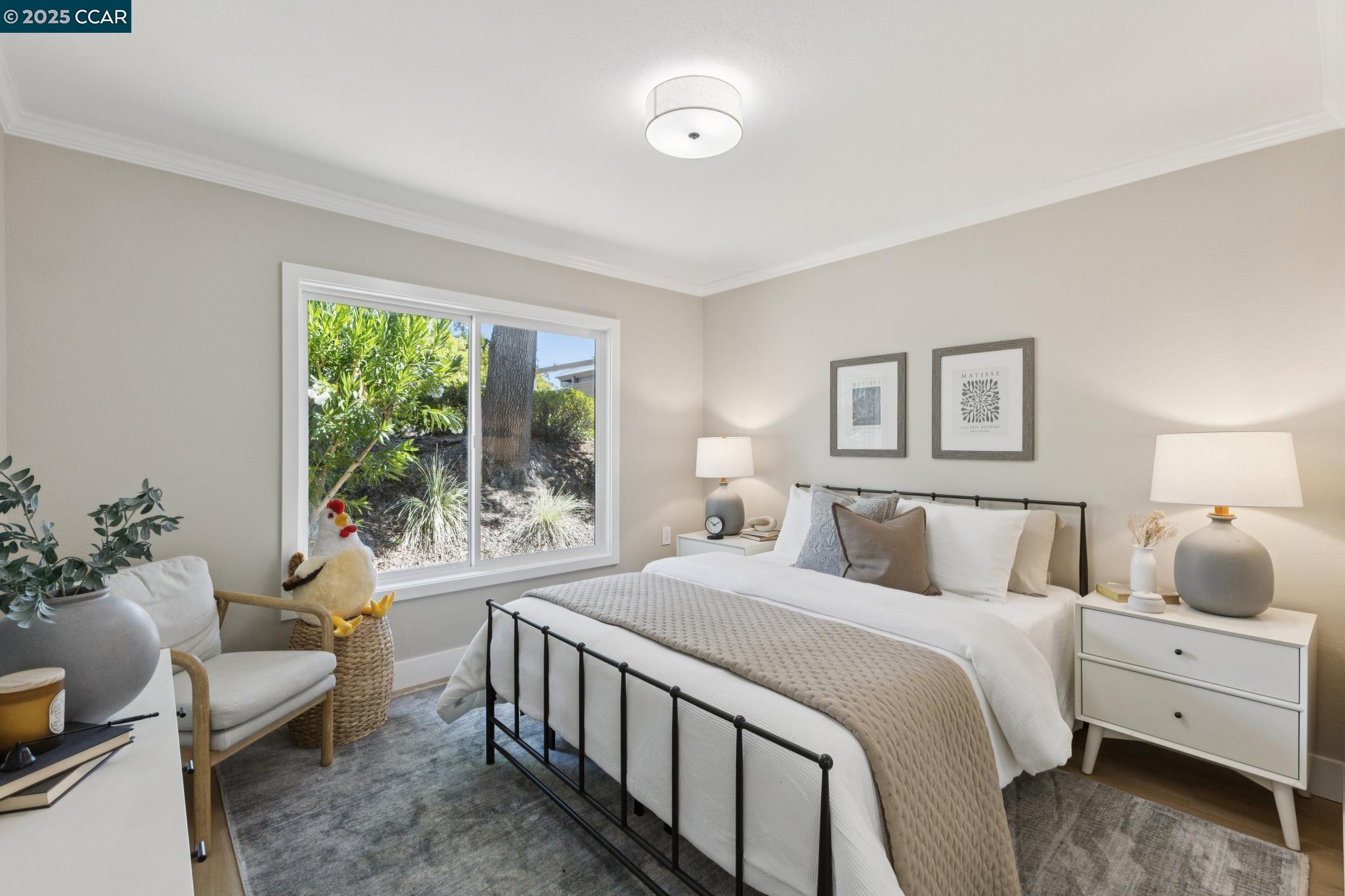 2101 Golden Rain Road, Unit 14 Walnut Creek, CA 94595 - Photo 27 of 52 a bedroom with a bed and a large window