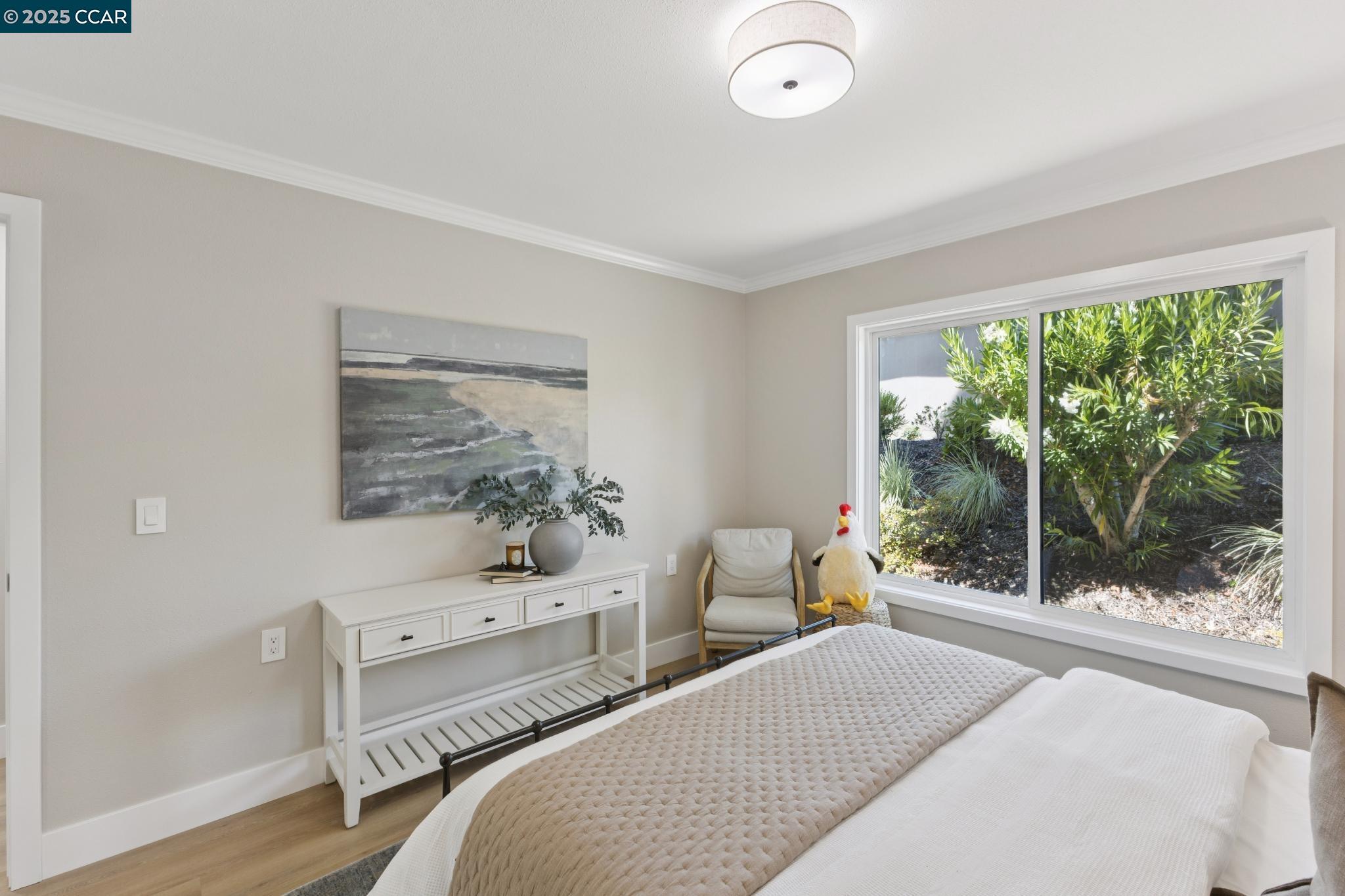 2101 Golden Rain Road, Unit 14 Walnut Creek, CA 94595 - Photo 28 of 52 a bedroom with a bed and large windows