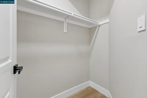 a bathroom with a double vanity sink toilet and shower