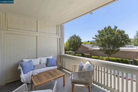 a view of a livingroom with wooden floor and entryway