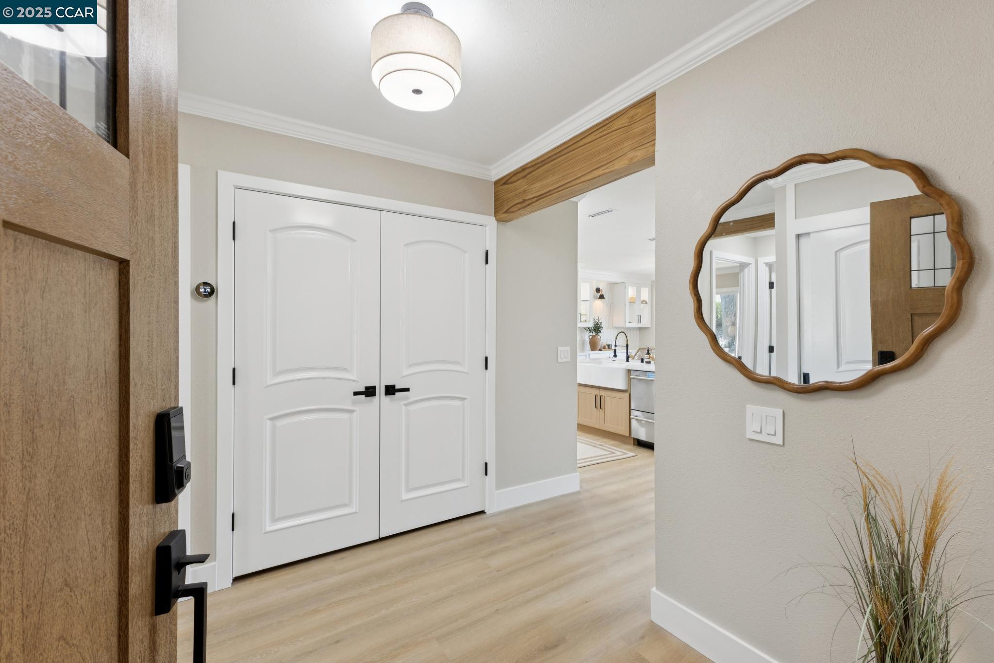 2101 Golden Rain Road, Unit 14 Walnut Creek, CA 94595 - Photo 43 of 52 a view of a livingroom with wooden floor and entryway