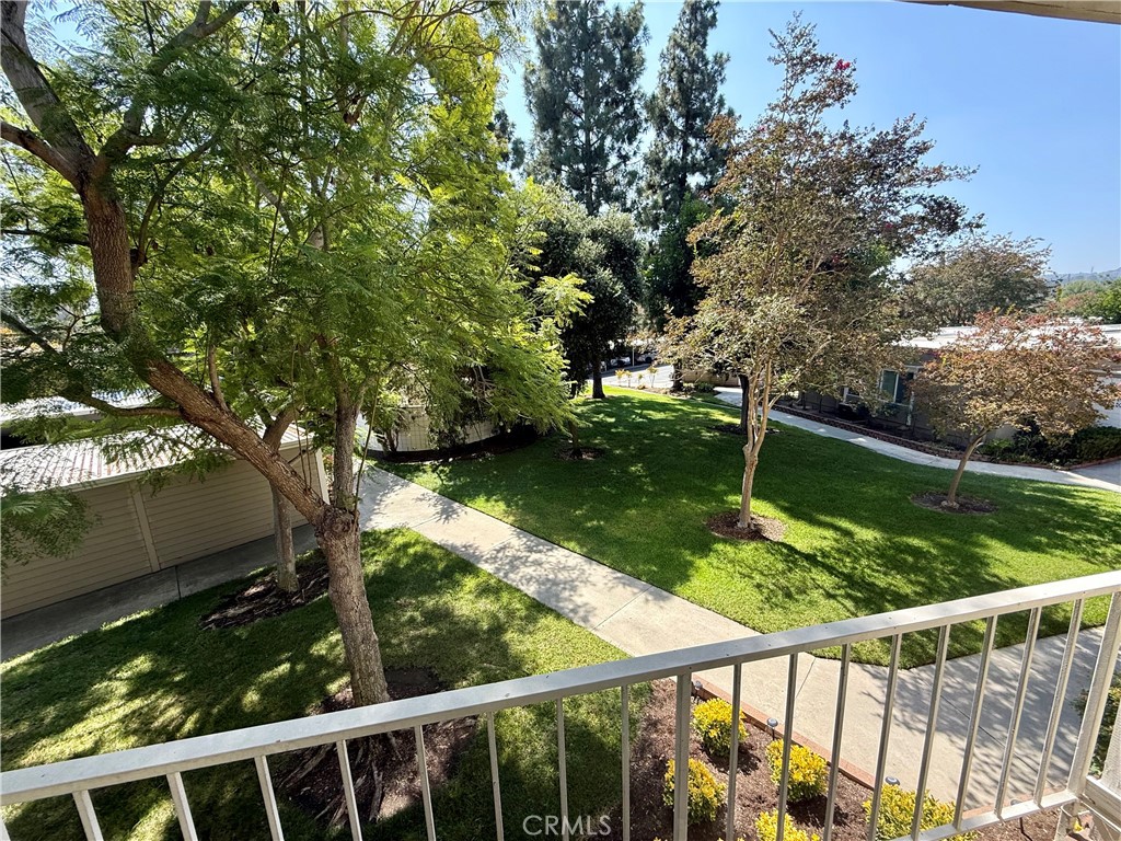 199 Avenida Majorca, Unit C Laguna Woods, CA 92637 - Photo 19 of 30 a view of a wooden deck with a yard