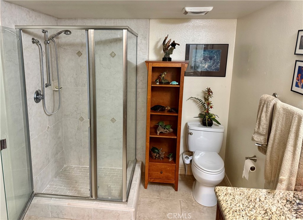 199 Avenida Majorca, Unit C Laguna Woods, CA 92637 - Photo 22 of 30 a bathroom with a toilet and a shower