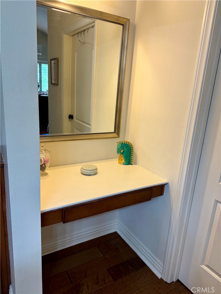 199 Avenida Majorca, Unit C Laguna Woods, CA 92637 - Photo 27 of 30 a bathroom with a sink and a mirror
