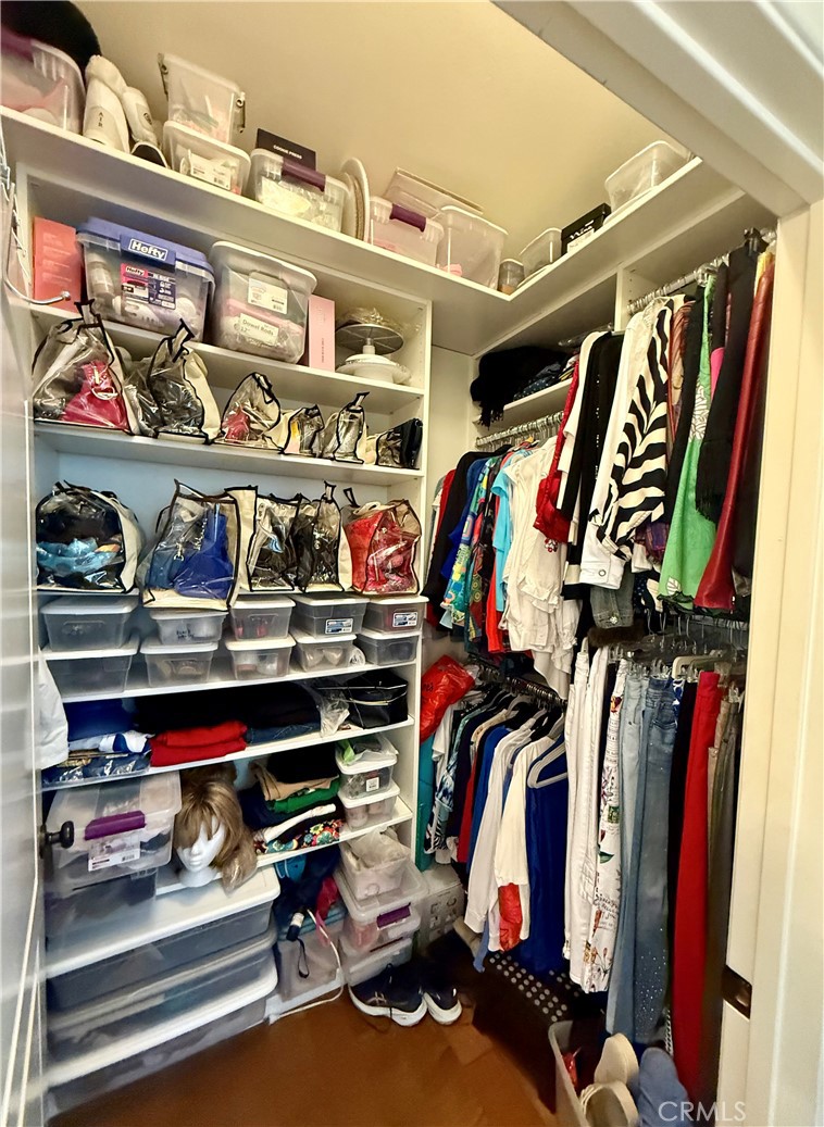 199 Avenida Majorca, Unit C Laguna Woods, CA 92637 - Photo 29 of 30 a view of walk in closet with clothes and shoes