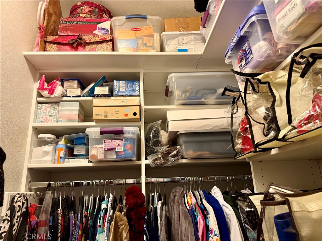 199 Avenida Majorca, Unit C Laguna Woods, CA 92637 - Photo 30 of 30 a view of walk in closet with clothes and shoes