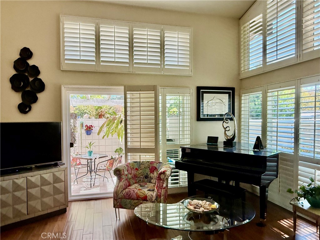 199 Avenida Majorca, Unit C Laguna Woods, CA 92637 - Photo 6 of 30 a living room with furniture and a flat screen tv