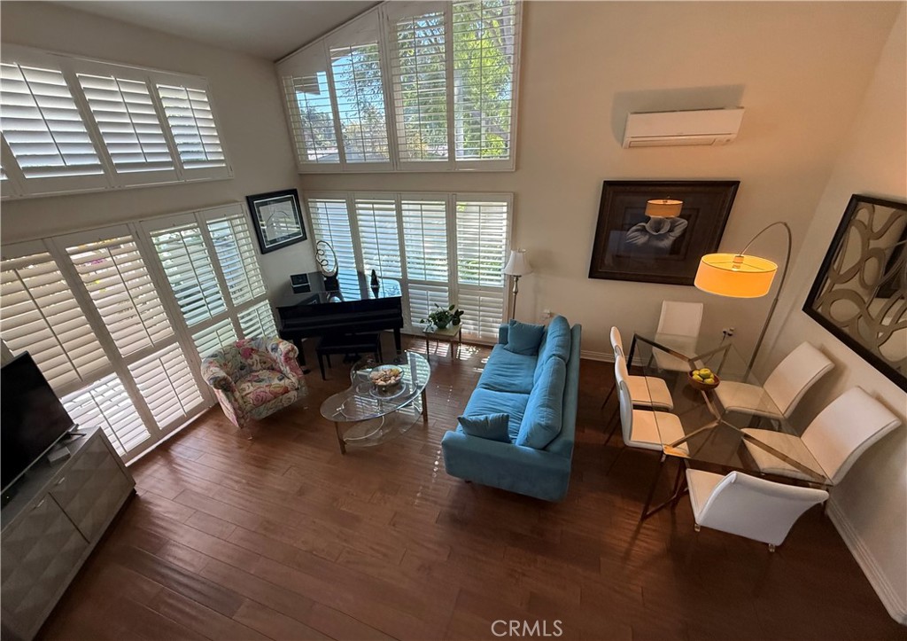 199 Avenida Majorca, Unit C Laguna Woods, CA 92637 - Photo 7 of 30 a living room with furniture and a fireplace