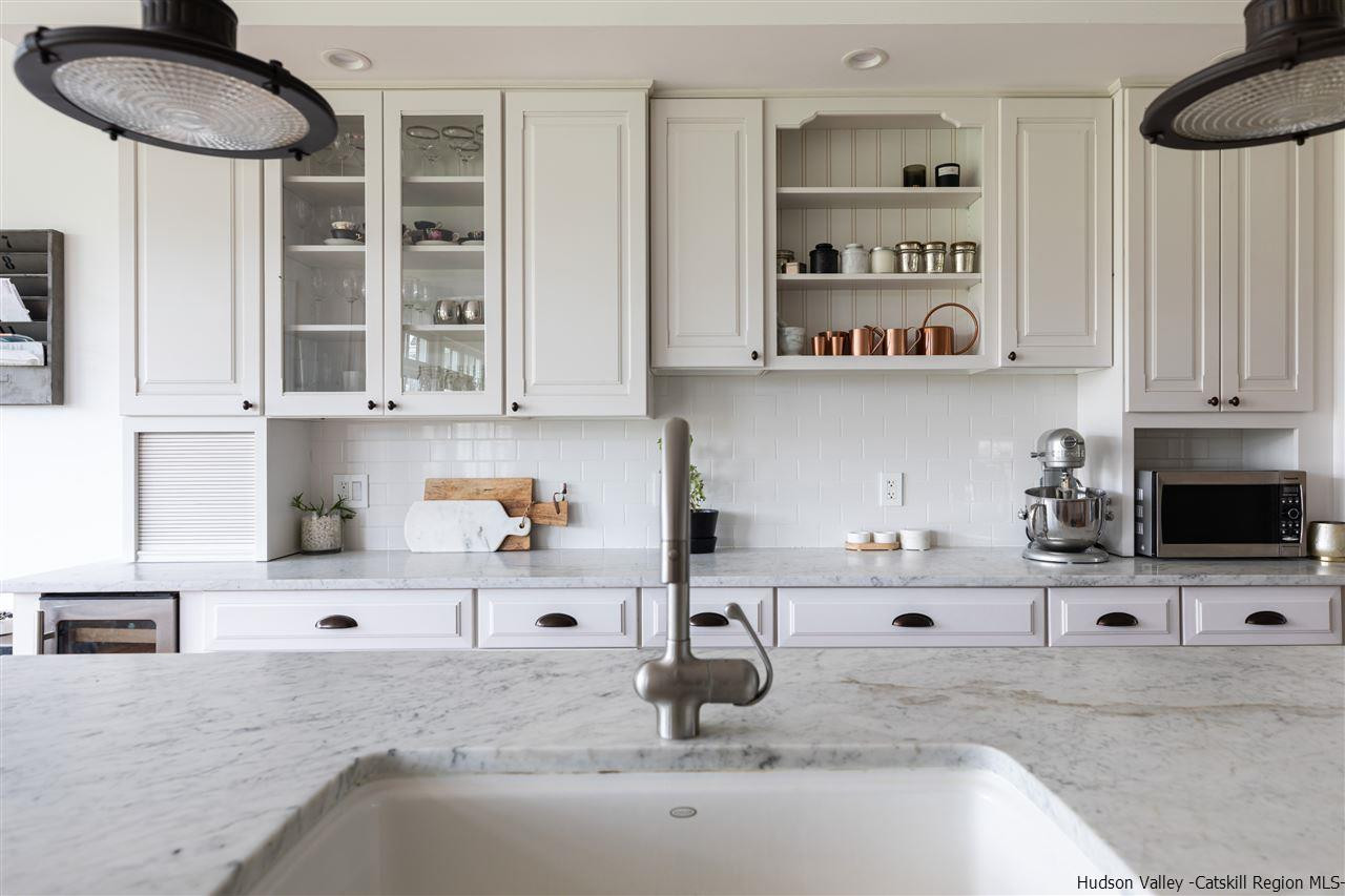 383 Pine Bush Road Stone Ridge, NY 12484 - Photo 13 of 35 a kitchen with stainless steel appliances cabinets a sink and a counter space