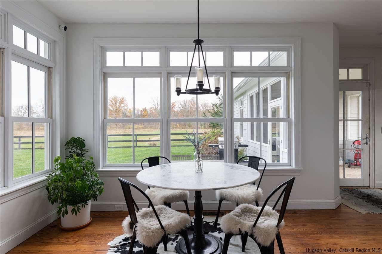 383 Pine Bush Road Stone Ridge, NY 12484 - Photo 14 of 35 a view of a dining room with furniture window and wooden floor