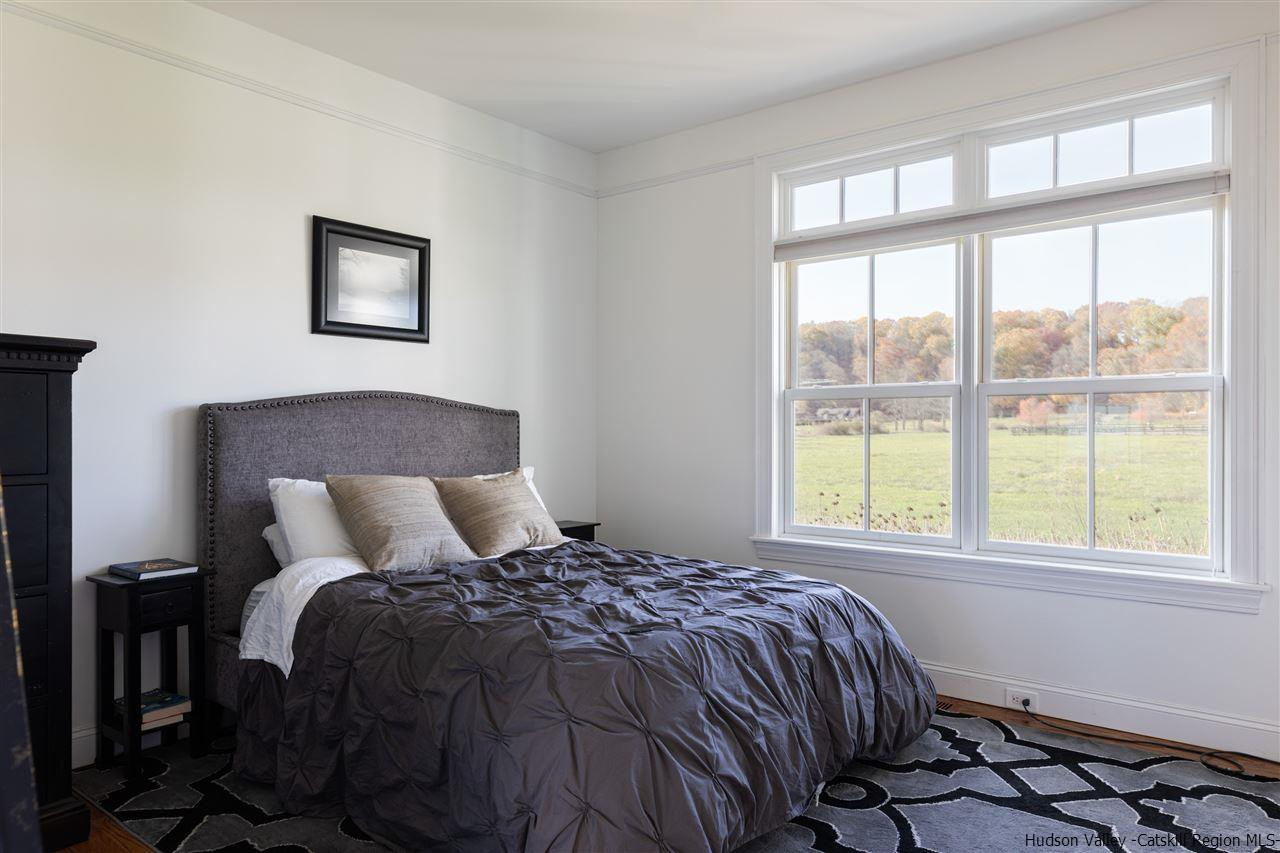 383 Pine Bush Road Stone Ridge, NY 12484 - Photo 20 of 35 a bedroom with a bed and a window
