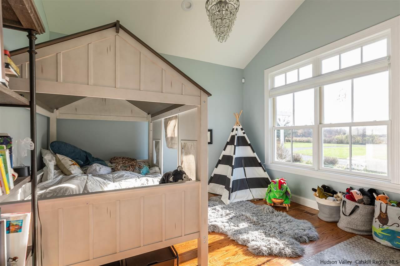383 Pine Bush Road Stone Ridge, NY 12484 - Photo 22 of 35 a living room with furniture and floor to ceiling windows