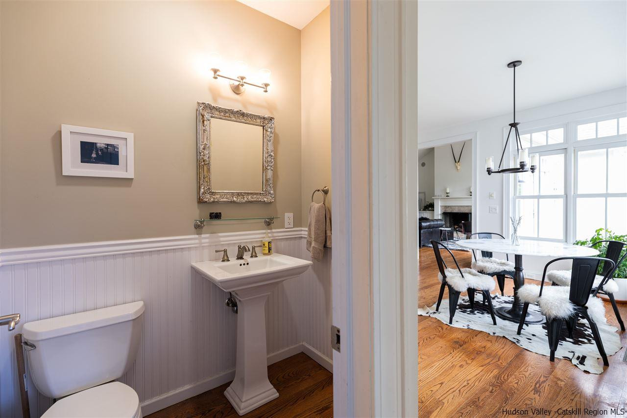383 Pine Bush Road Stone Ridge, NY 12484 - Photo 24 of 35 a bathroom with a sink a toilet and a mirror