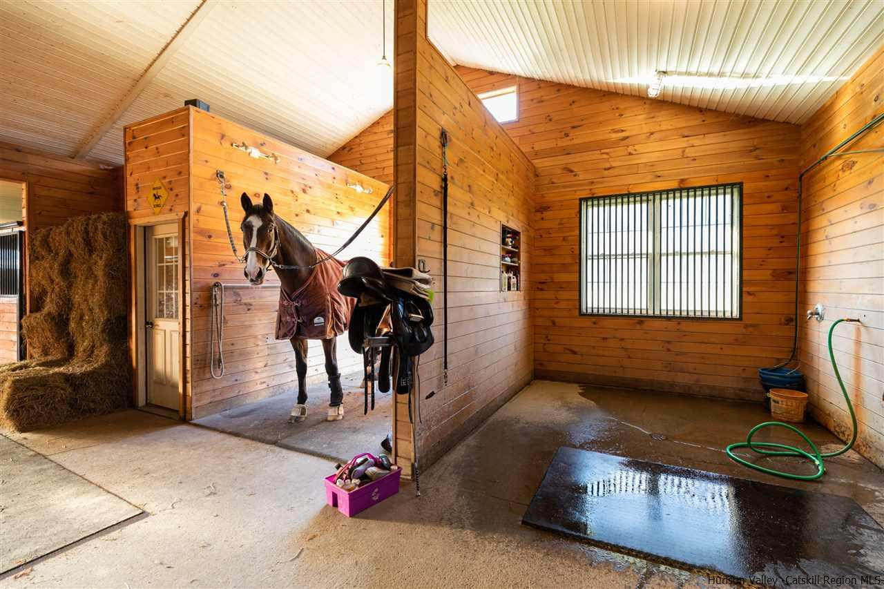 383 Pine Bush Road Stone Ridge, NY 12484 - Photo 32 of 35 a living room with furniture a rug and a window