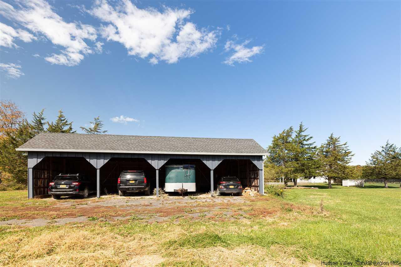 383 Pine Bush Road Stone Ridge, NY 12484 - Photo 33 of 35 a view of a house with a yard and garage