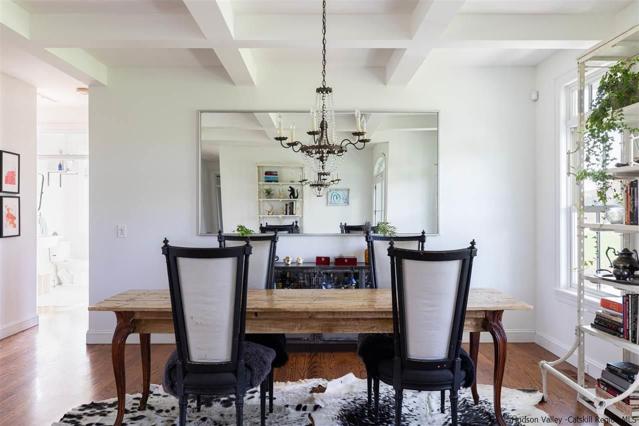 383 Pine Bush Road Stone Ridge, NY 12484 - Photo 8 of 35 a view of a dining room with furniture and a chandelier