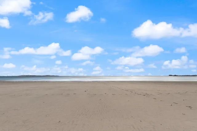 a kitchen with granite countertop a sink stove and cabinets