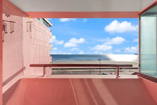 a large bed sitting in a bedroom next to a window