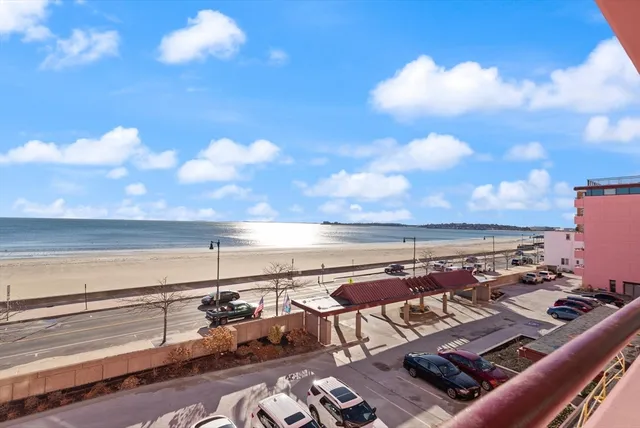 a spacious bedroom with a large bed and a large window