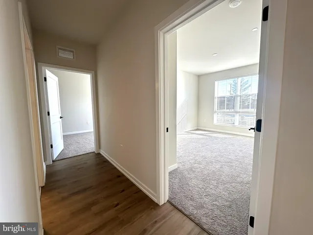 an empty room with a empty space and window