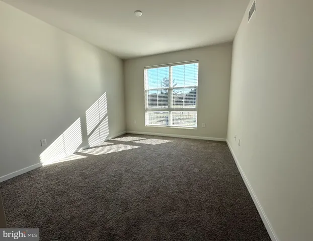 an empty room with staircase