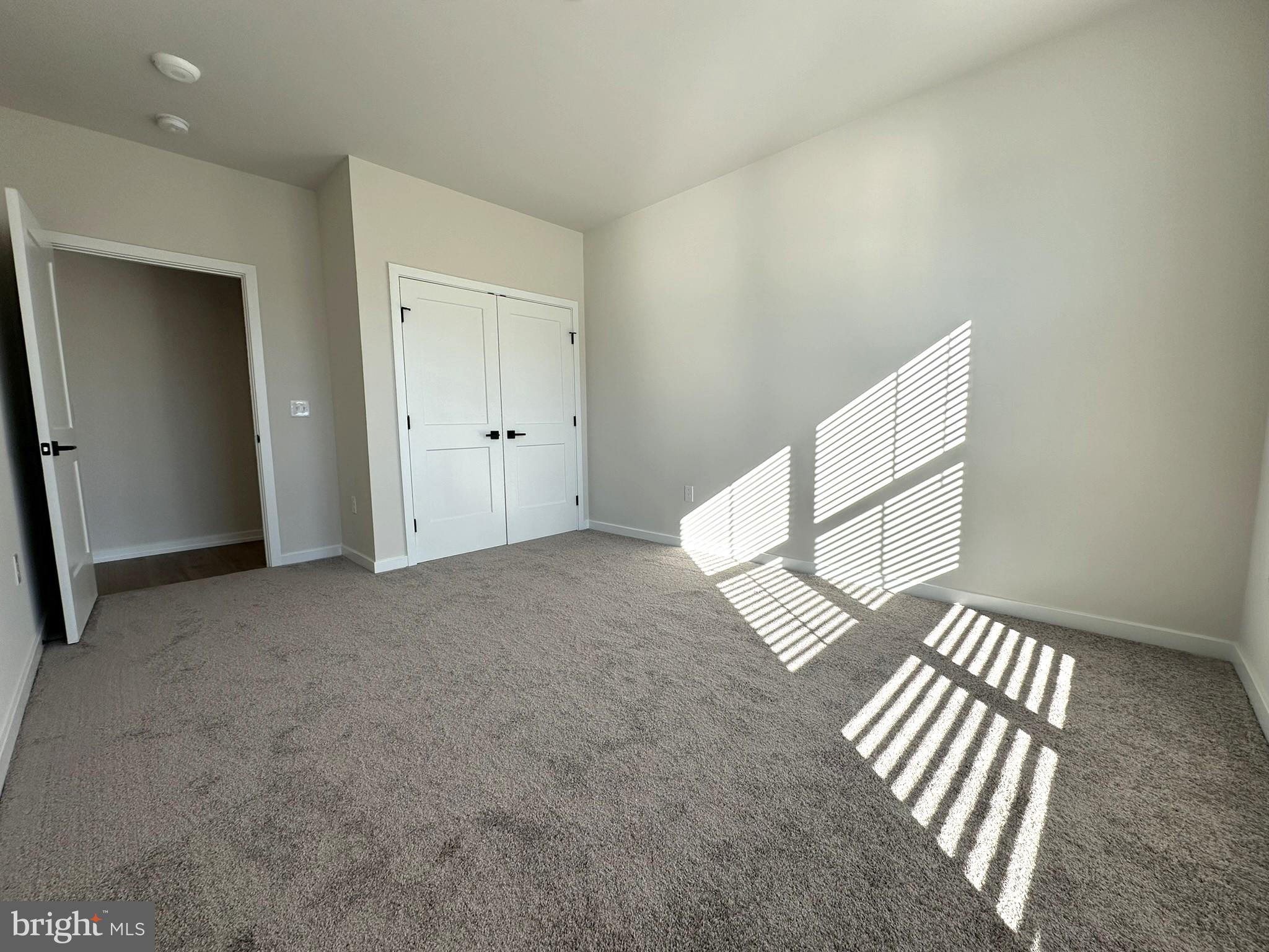 409 West Butler Avenue, Unit 318 Chalfont, PA 18914 - Photo 14 of 32 an empty room with staircase