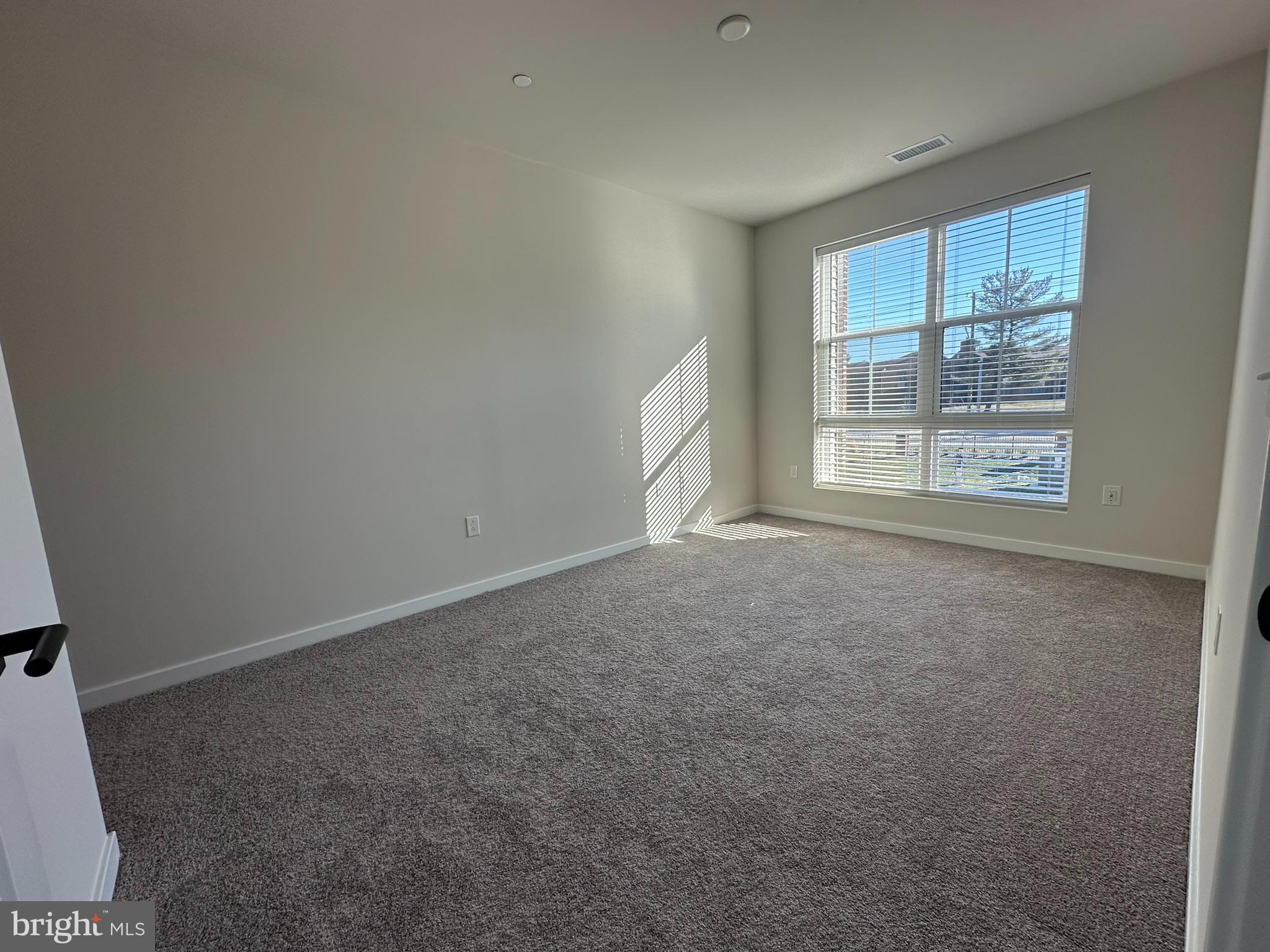 409 West Butler Avenue, Unit 318 Chalfont, PA 18914 - Photo 18 of 32 an empty room with a window