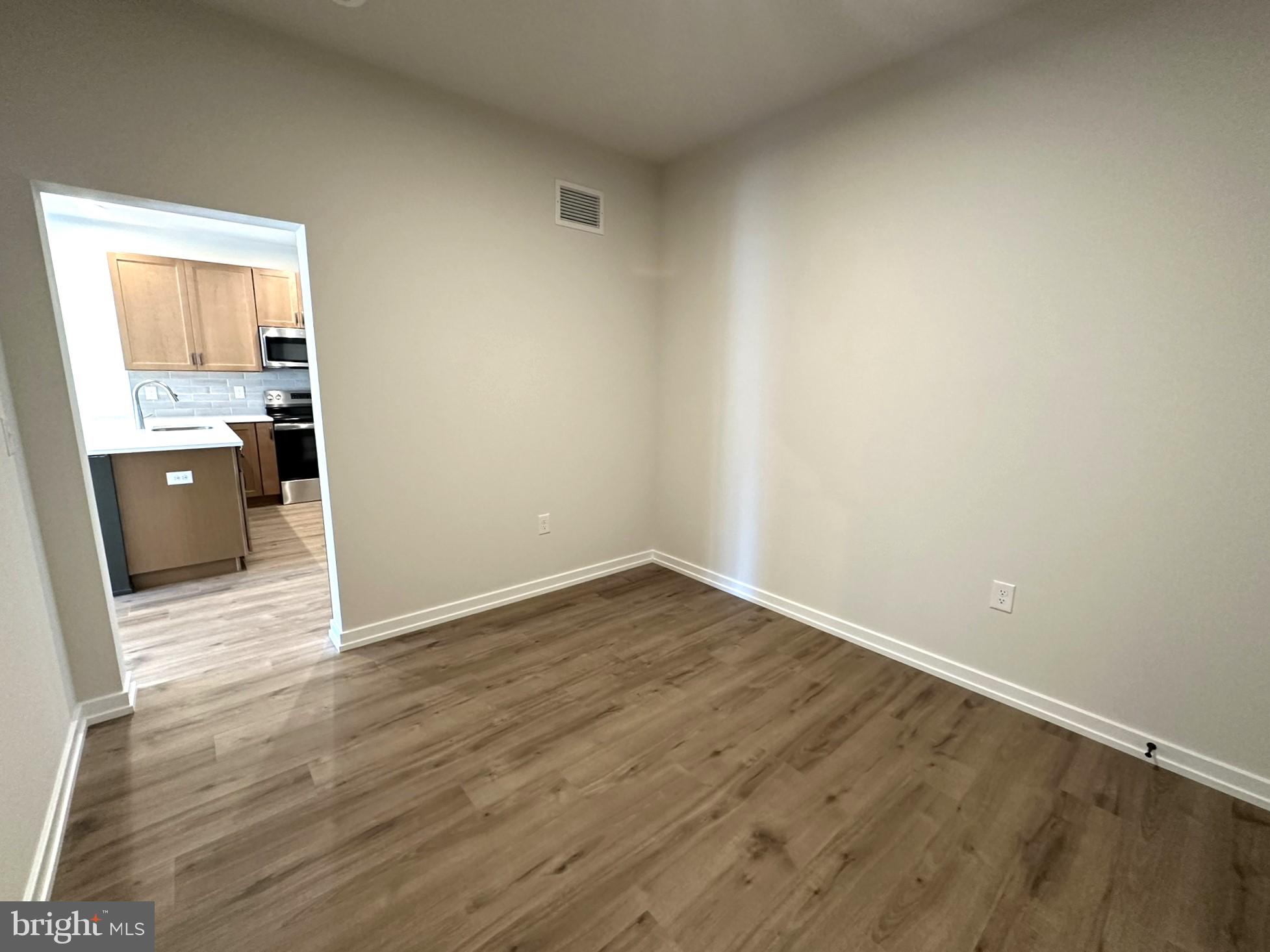 409 West Butler Avenue, Unit 318 Chalfont, PA 18914 - Photo 24 of 32 wooden floor in an empty room