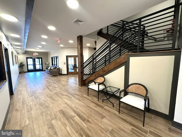 a view of an entryway with wooden floor