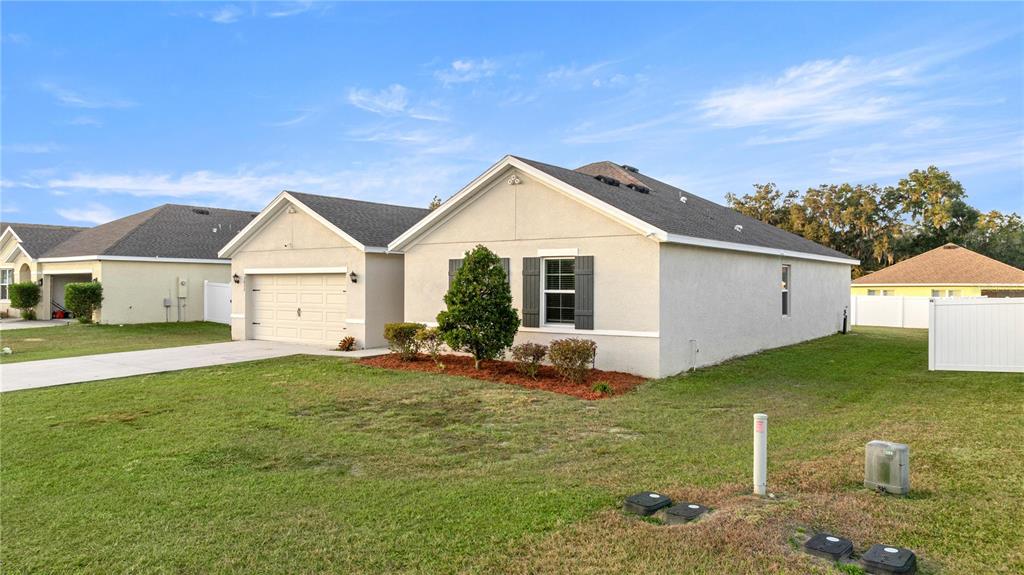 3833 Southeast 98th Place Belleview, FL 34420 - Photo 2 of 34 a view of a house with backyard