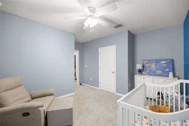 a bedroom with furniture and a chandelier
