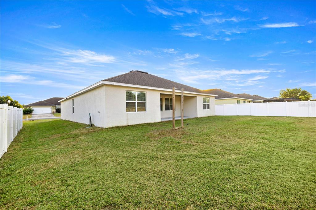3833 Southeast 98th Place Belleview, FL 34420 - Photo 34 of 34 a view of a house with a yard