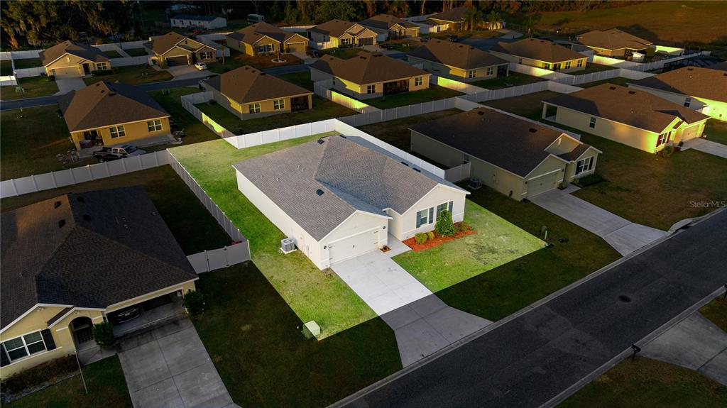 3833 Southeast 98th Place Belleview, FL 34420 - Photo 5 of 34 an aerial view of a house