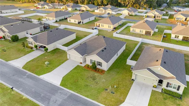 an aerial view of a house with a swimming pool