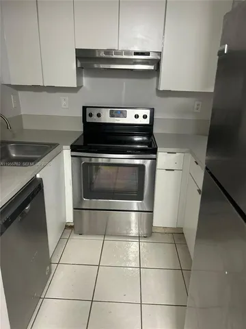 a bathroom with a toilet and a bathtub