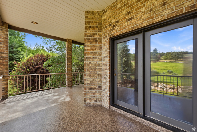 3535 Homestead Road Park City, UT 84098 - Photo 35 of 81 Covered outdoor patio featuring a brick exterior and a textured flooring surface