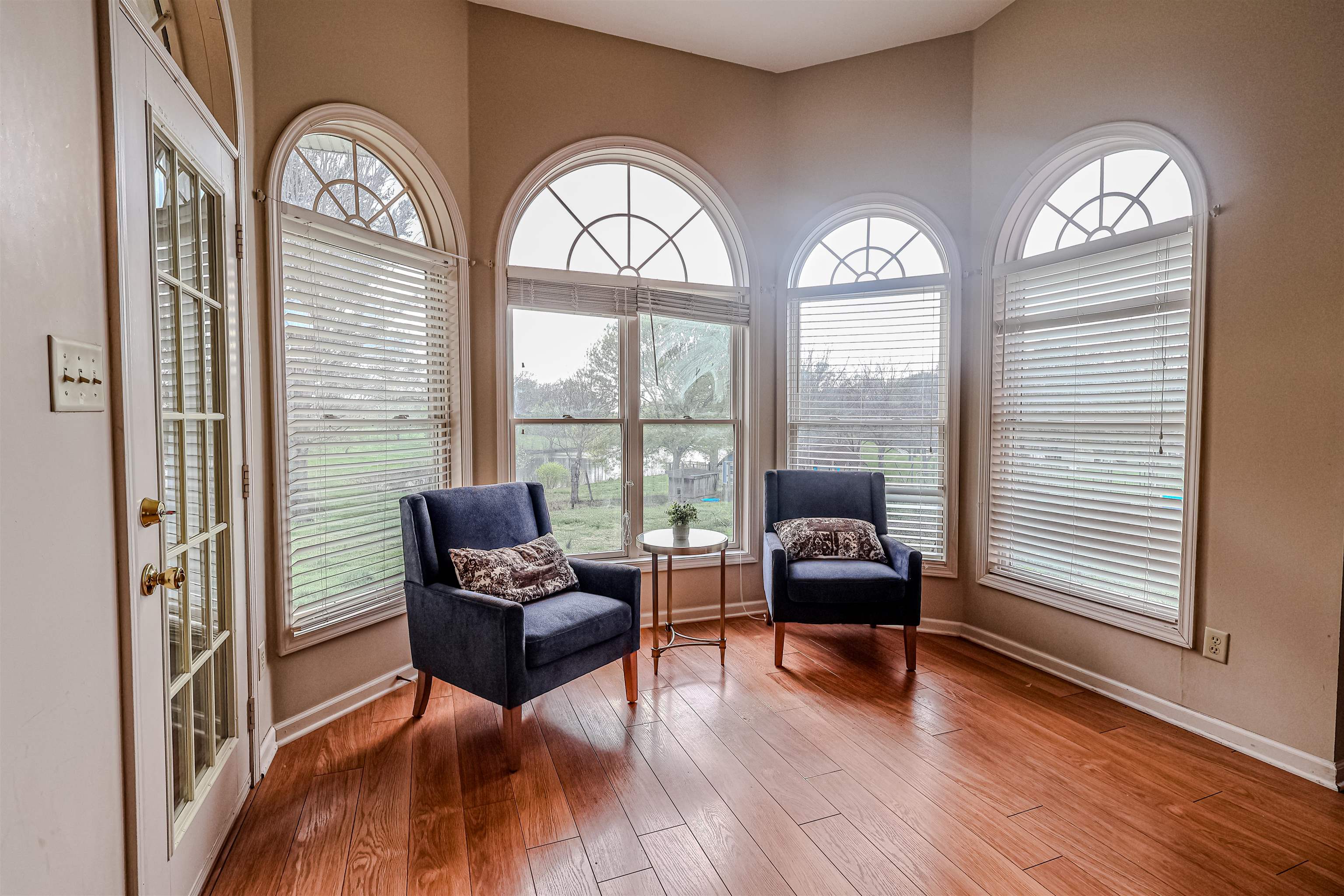 121 Reed Circle Drummonds, TN 38023 - Photo 10 of 38 Living area featuring plenty of natural light, baseboards, and wood finished floors