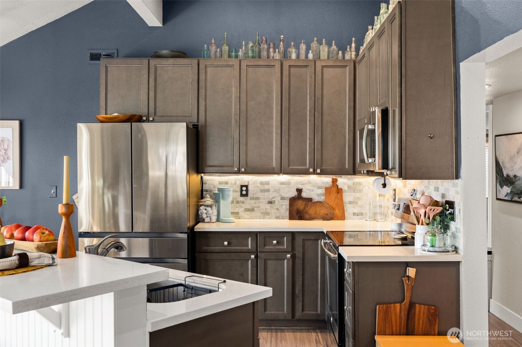 2827 Alder Street Bremerton, WA 98310 - Photo 11 of 35 a kitchen with kitchen island a sink appliances and cabinets