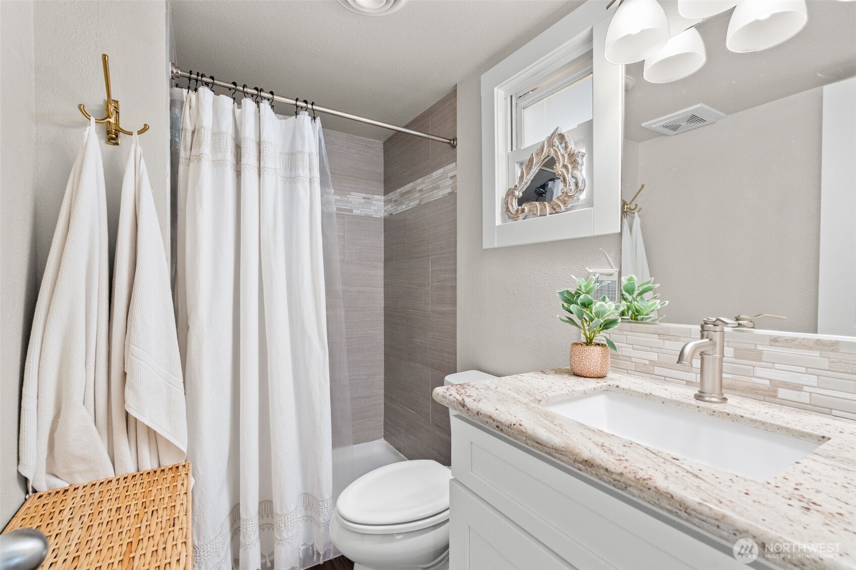 2827 Alder Street Bremerton, WA 98310 - Photo 15 of 35 a bathroom with a granite countertop sink toilet and a mirror