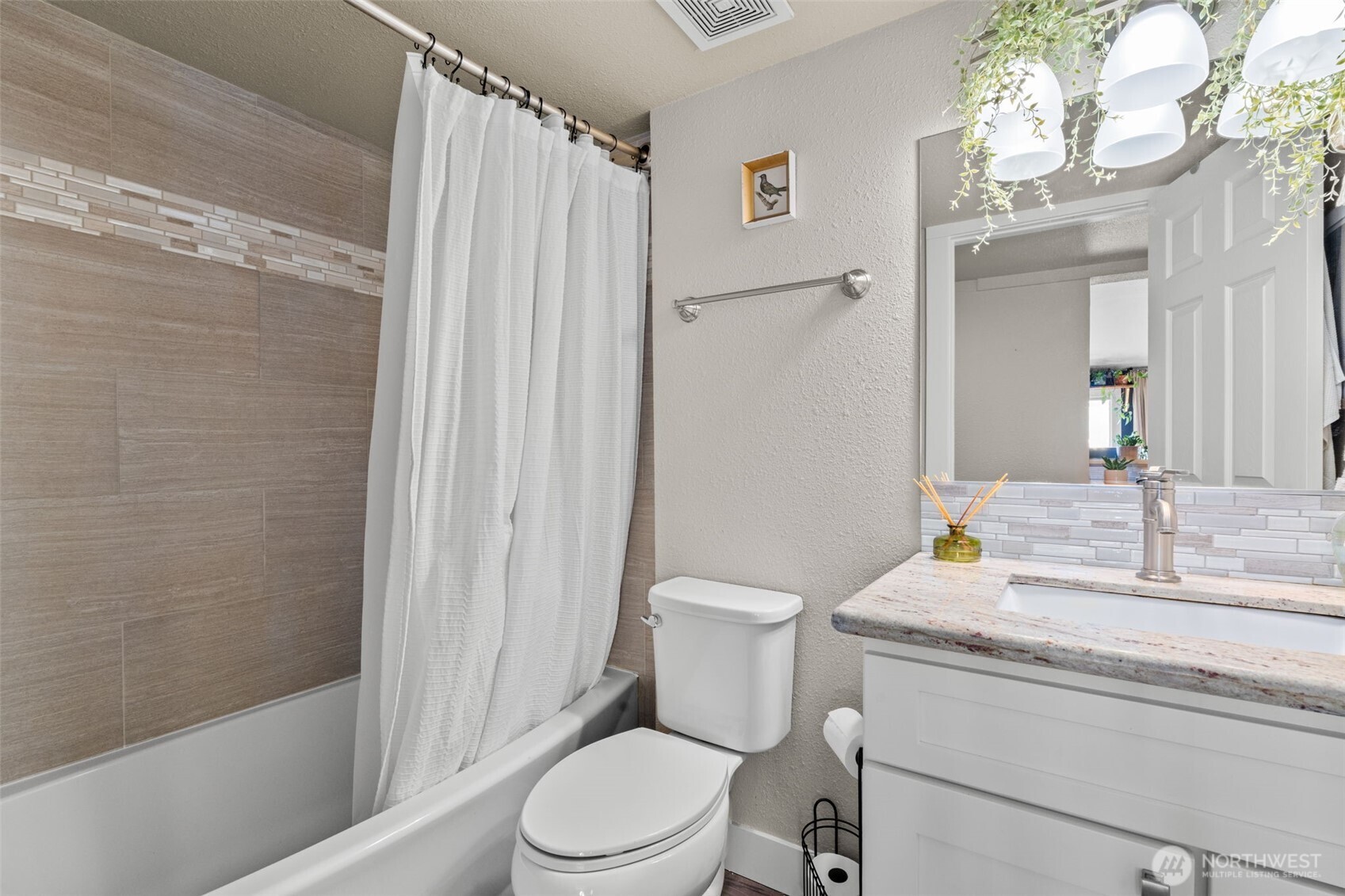 2827 Alder Street Bremerton, WA 98310 - Photo 16 of 35 a bathroom with a granite countertop sink toilet and shower