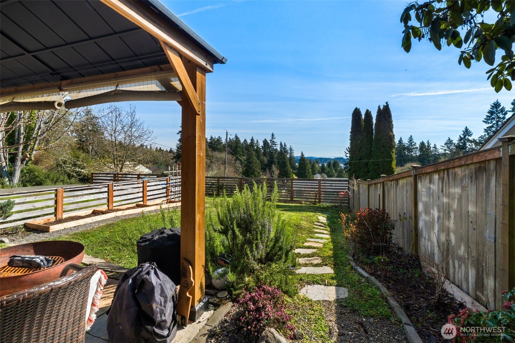 2827 Alder Street Bremerton, WA 98310 - Photo 30 of 35 a view of a patio with chair and table potted plants and floor to ceiling window