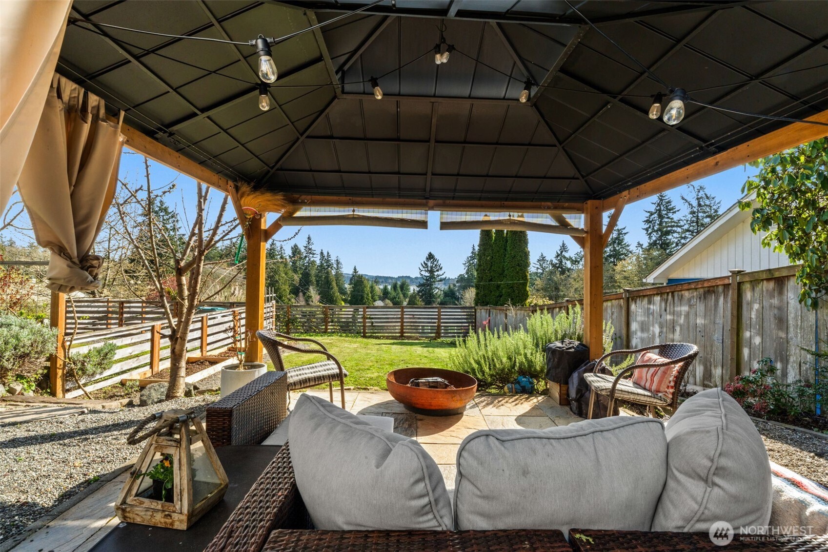 2827 Alder Street Bremerton, WA 98310 - Photo 31 of 35 a view of a patio with couches chairs potted plants and palm tree