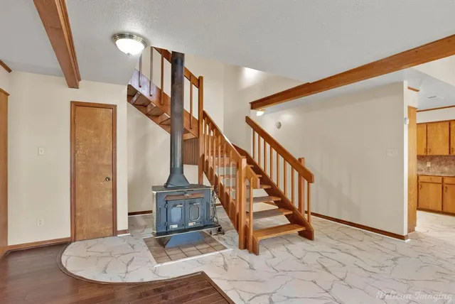 a view of entryway and hall with a front door