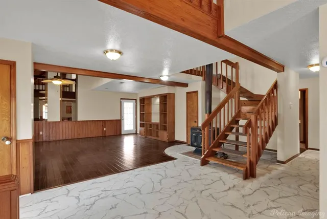 a view of a hall with stairs