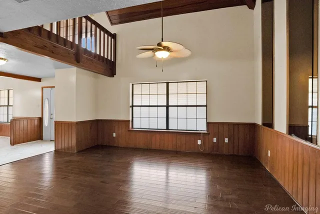 a view of room with window and wooden floor