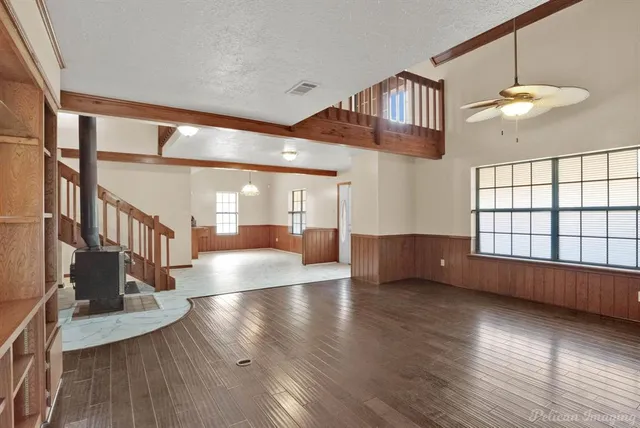 a view of an entryway with wooden floor