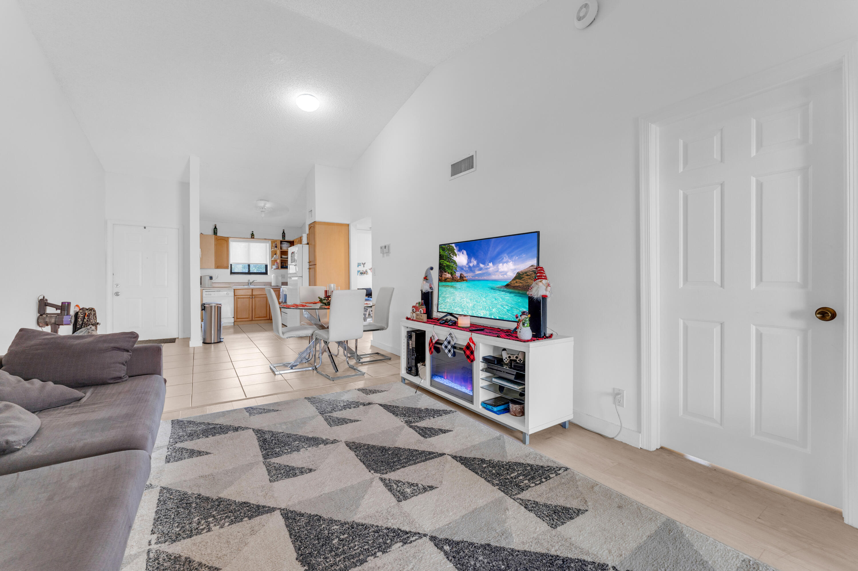 2800 Palmwood Terrace, Unit 2190 Boca Raton, FL 33431 - Photo 22 of 42 a living room with furniture and a flat screen tv