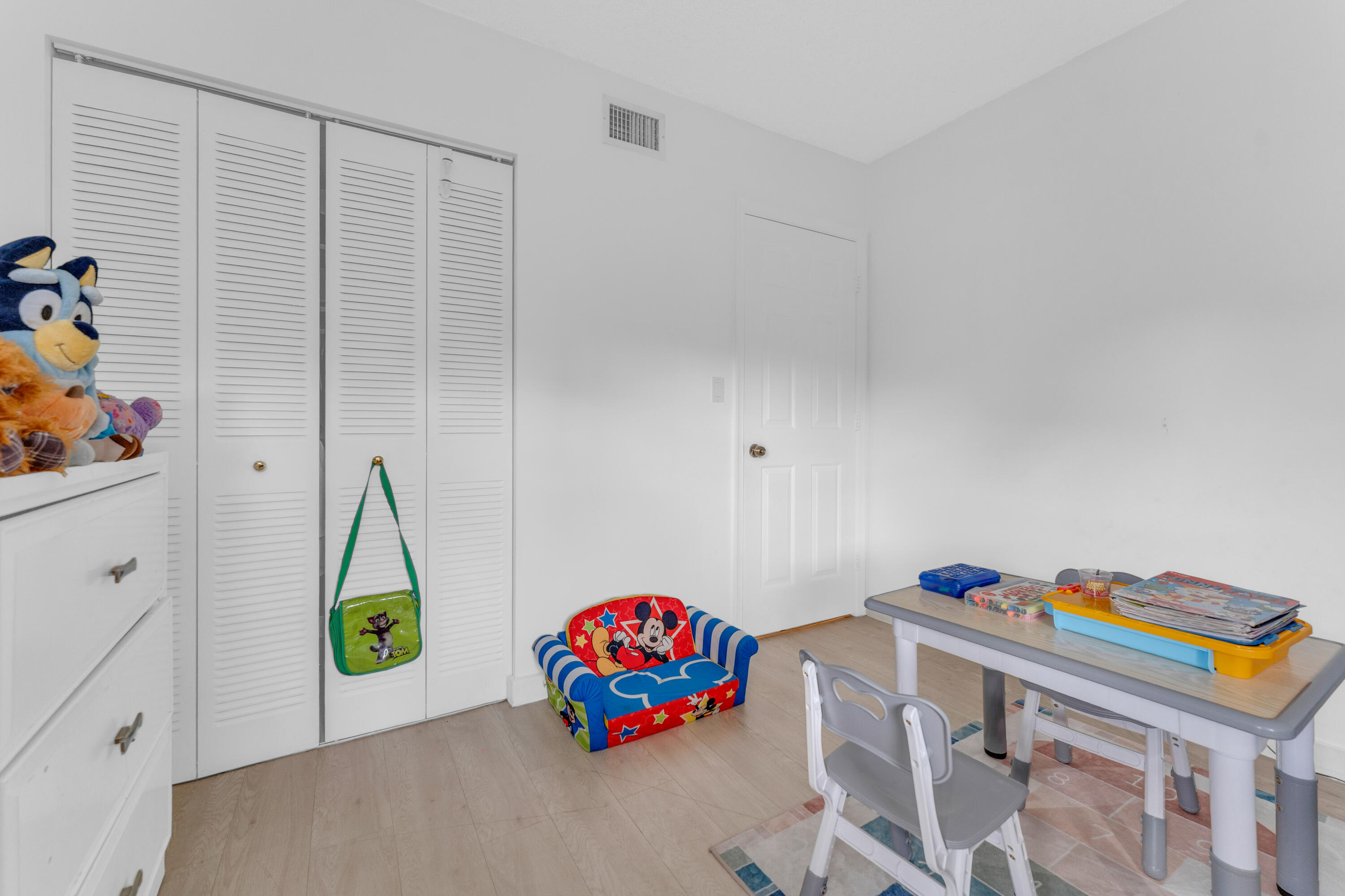 2800 Palmwood Terrace, Unit 2190 Boca Raton, FL 33431 - Photo 25 of 42 a bedroom with a bed and a couch
