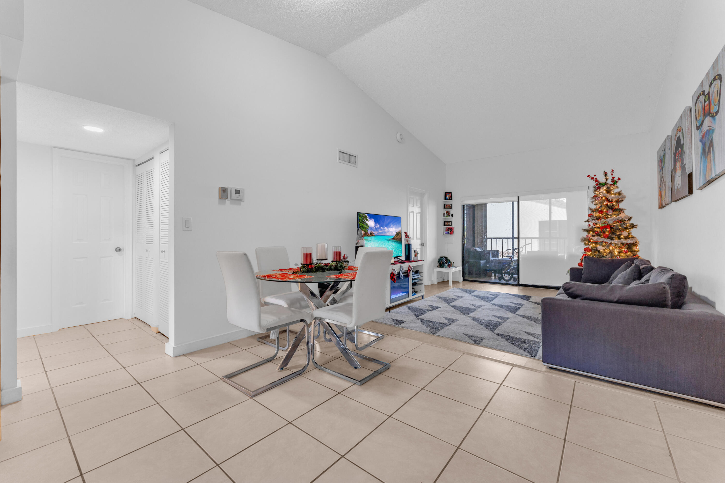 2800 Palmwood Terrace, Unit 2190 Boca Raton, FL 33431 - Photo 27 of 42 a living room with furniture and a window